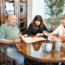 Vicki and Nick Palumbo meet with membership volunteer, LaVonne Ashwood, to join Senior Village.