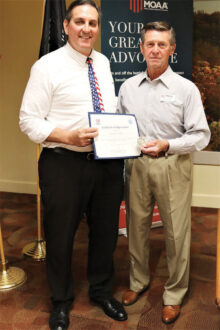 Colonel Nagy presents the Certificate of Appreciation and MOAA Challenge Coin to Douglas Harpold.