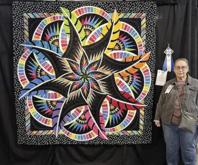 Doreen Diaz placed first with her quilt "Chasing Rainbows."