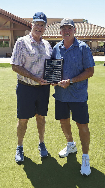 Club President Don Dow handing Gross Champion award to Carter Luther.