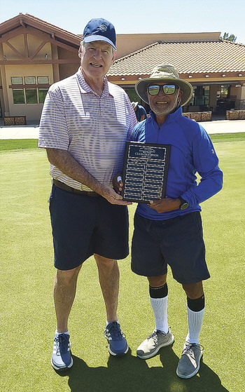 Club President Don Dow handing Net Champion award to Ashvin Patel.