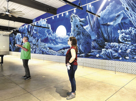 Curators with Garcia mural in the background by Teri Jensen Freeman