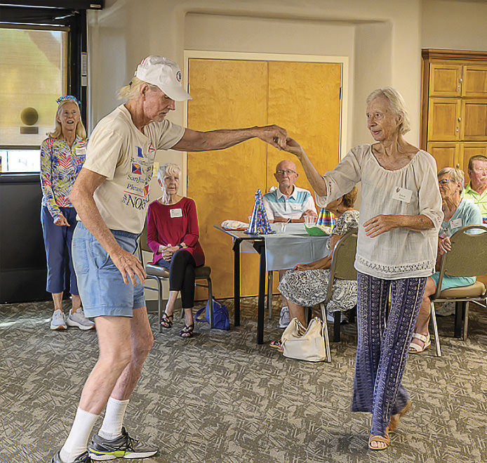 Members Erica Amanzia dancing with Neil Grenzebach